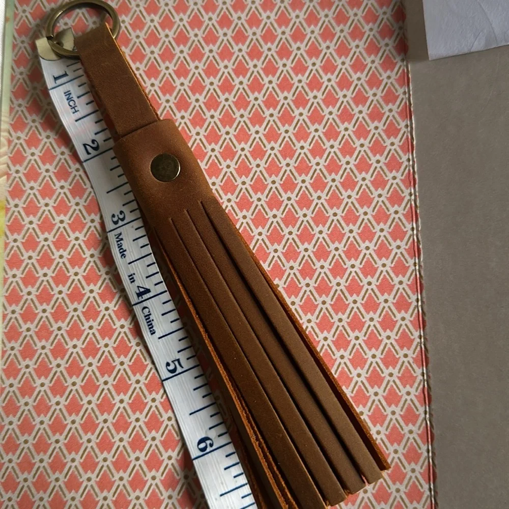 Brown TASSEL KEYCHAIN/bag charm with detachable scarf.